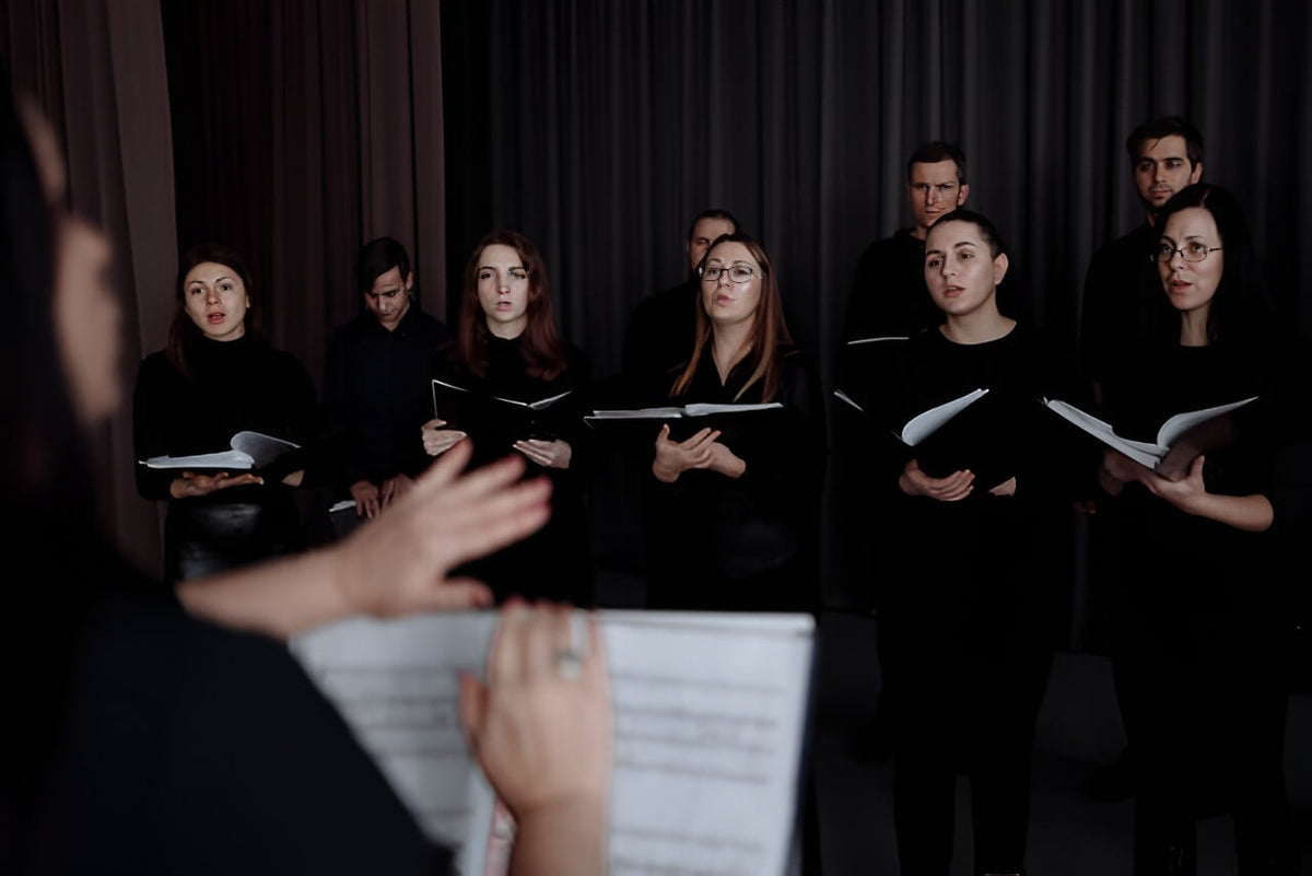 Choral conductor leading ensemble
