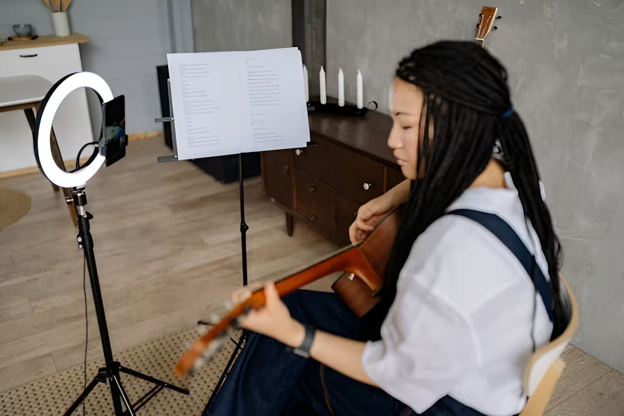 Student reviewing audition recording with professional guidance