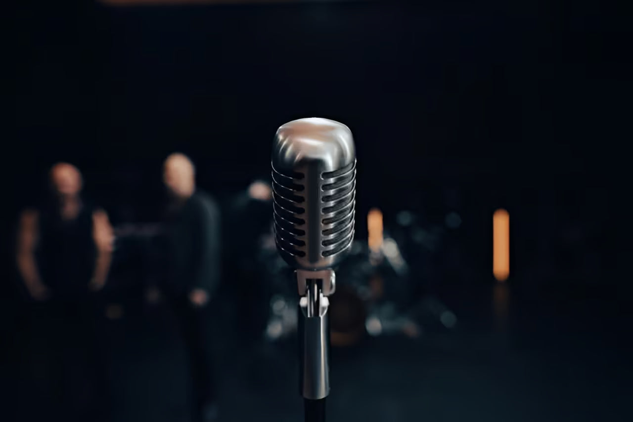 Musician performing live audition on stage at conservatory